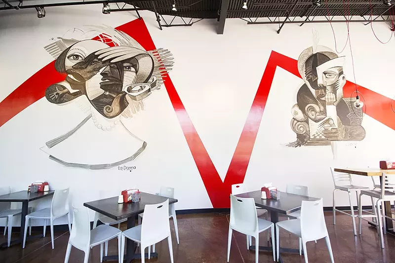 A striking black, white and red color scheme gives 'Zza's dining room a modern look. - PHOTO BY MABEL SUEN