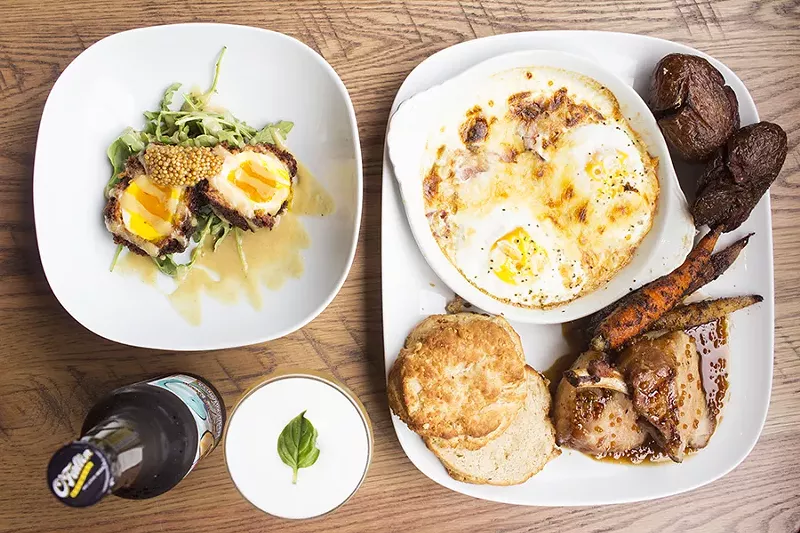 On offer at the Blue Duck: a Scotch egg, bourbon basil fizz cocktail and grilled pork chop with shirred egg, glazed baby carrots and fried smoked potatoes. - PHOTO BY MABEL SUEN