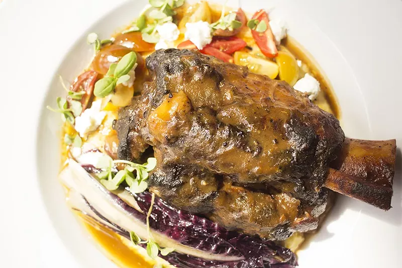 Pork osso bucco with herb and goat cheese polenta, treviso and heirloom tomatoes. - MABEL SUEN