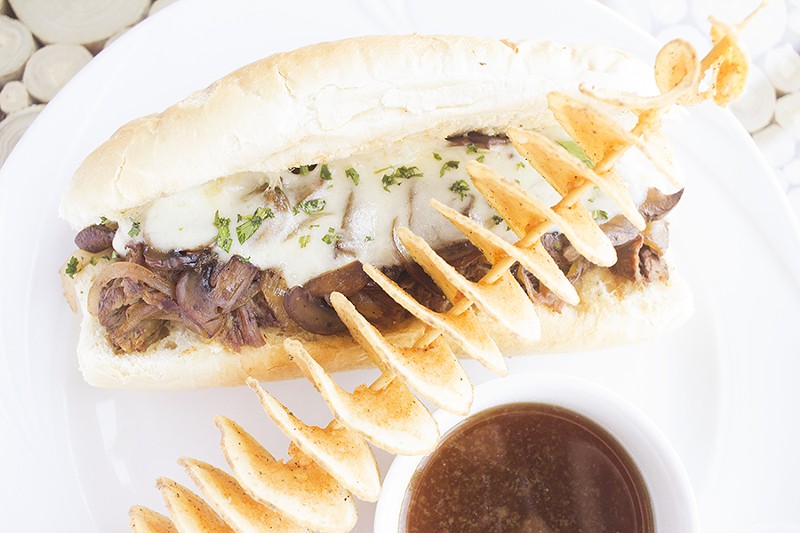 Braised chuck roast sits on a Balkan-style hoagie with caramelized mushroom and onions and smoked provolone. - PHOTO BY MABEL SUEN