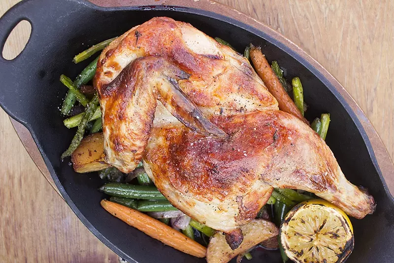 The brathendl is a classic German presentation of a half spit-roasted chicken with seasoned veggies. - PHOTO BY MABEL SUEN