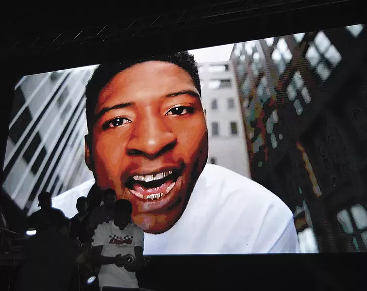 At a recent concert, LA4SS performed in front of blown-up images of his younger self. - BEN WESTHOFF