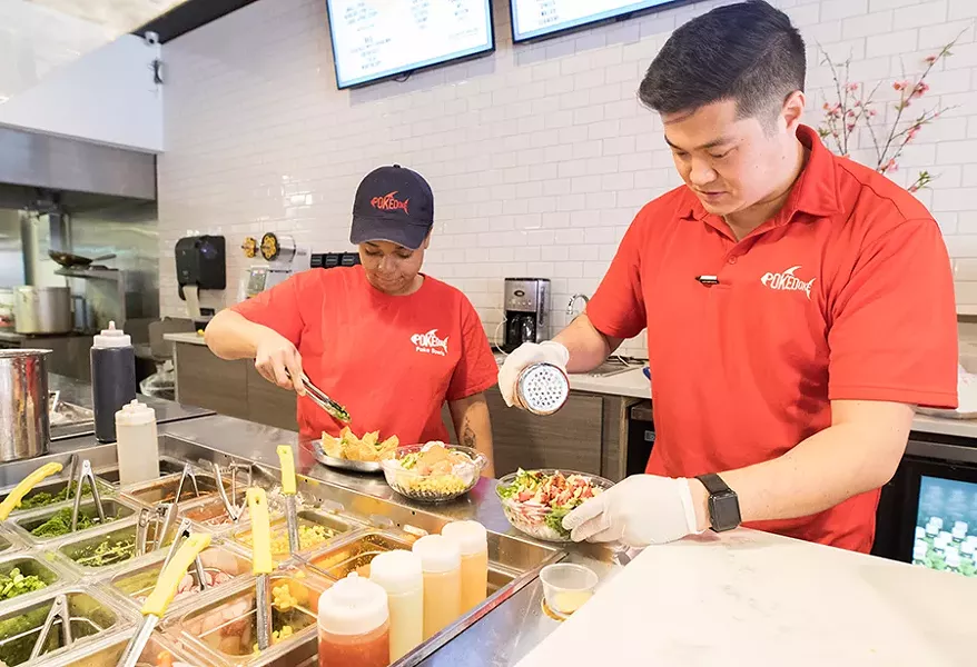 Shih and employee Erin Mann assemble the bowls Chipotle-style in an assembly line. - MABEL SUEN