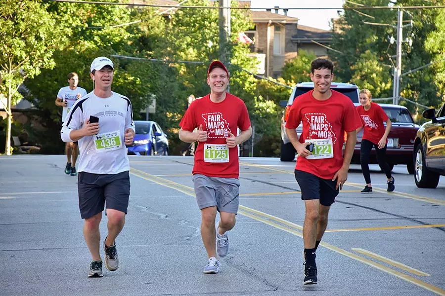 Cort VanOstran, center, jogs the Fair Maps 5K in Clayton with running buddy Jason Growe, left, and campaign staffer Alex Dubinsky. - DOYLE MURPHY