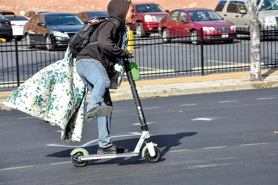 An unlocked Lime scooter give Jaz a few minutes of joy. - DOYLE MURPHY