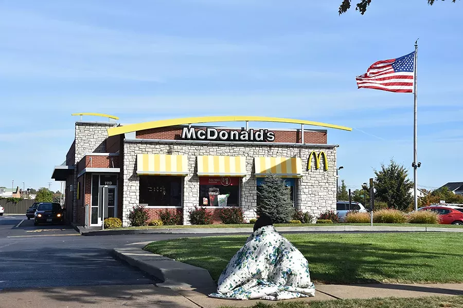 The edge of the McDonald's drive-through is one of Jaz's primary panhandling spots. - DOYLE MURPHY