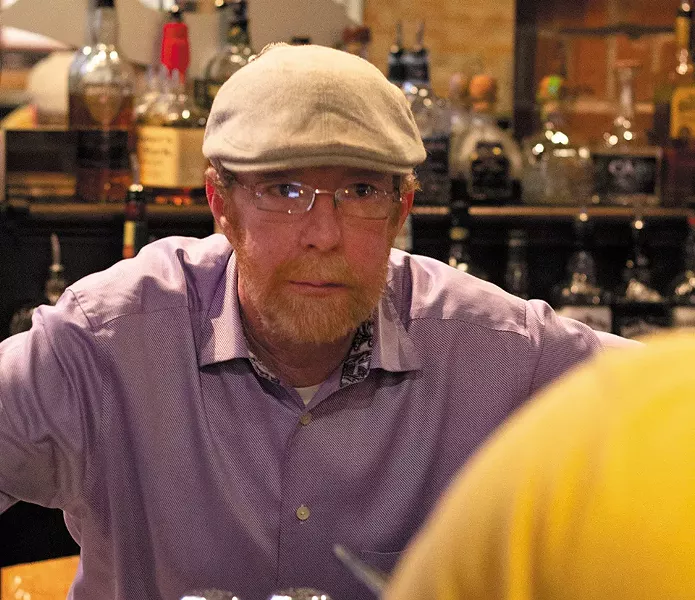 Dan Swinford leans in to catch an order at Three Monkeys. - RYAN GINES