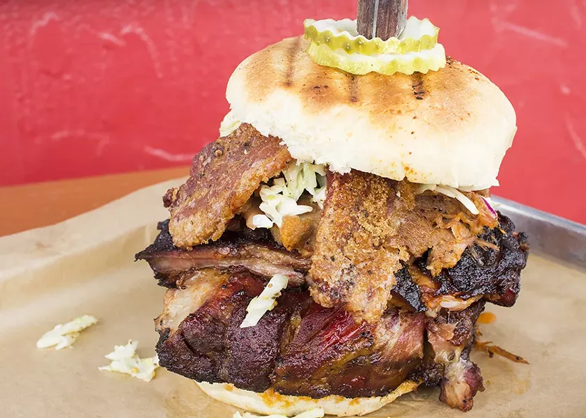 The "Pig Daddy" sandwich with pork steak, spare ribs, pulled pork, candied bacon, pickles and slaw on brioche. - MABEL SUEN