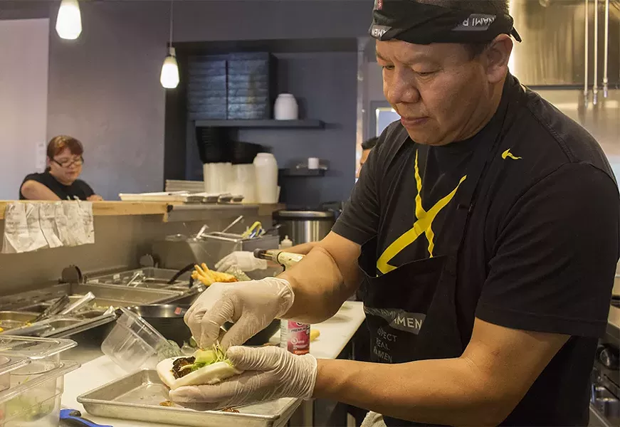 A cook at Nami Ramen. - PHOTO BY MABEL SUEN