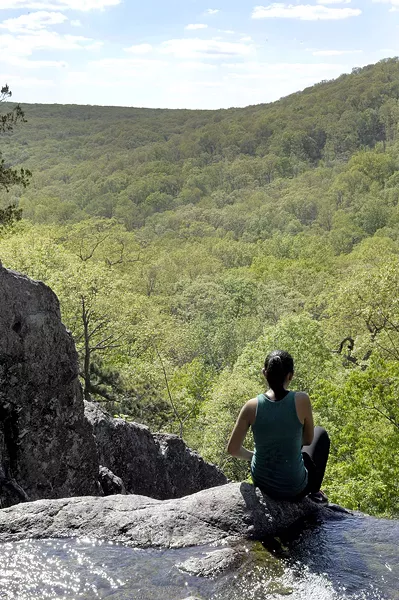 A hiker contemplates the view - PHOTO BY KELLY GLUECK