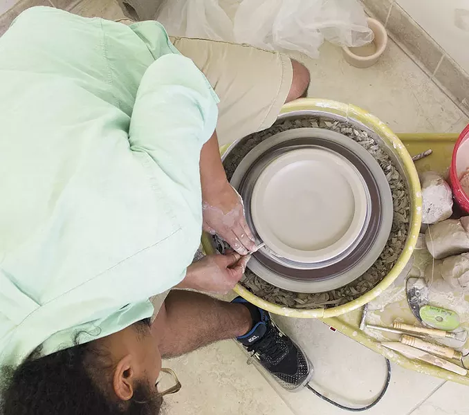 Along with high art, Irving crafts usable dishware for people who can't afford handmade dishes. - PHOTO BY DANNY WICENTOWSKI