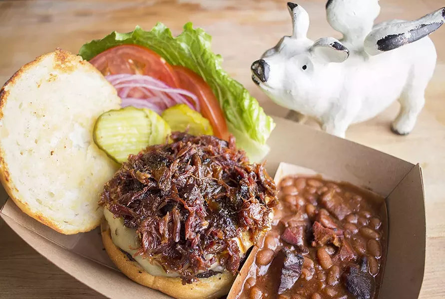 A half-pound burger topped with "Rib Jam" and served with pit beans. - PHOTO BY MABEL SUEN