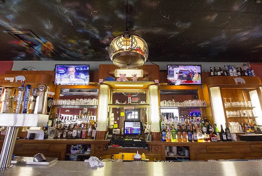 Hogs figure prominently at the bar at Super's Bungalow. - PHOTO BY MABEL SUEN