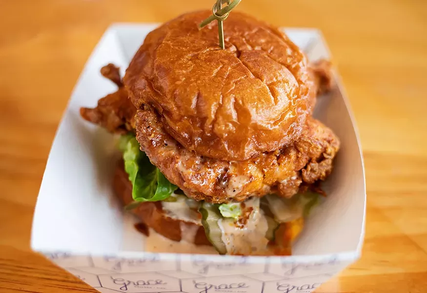 The late-night chicken sandwich with lettuce, onion, pickles, Comeback sauce and added queso on a brioche bun. - MABEL SUEN