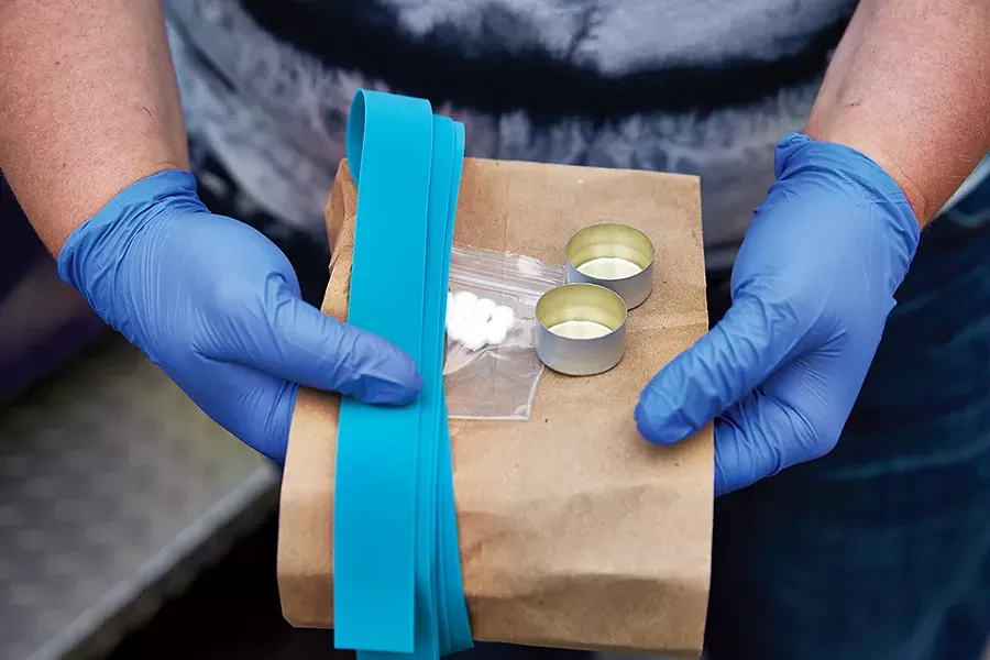 Tourniquets, cotton pellets and single-use cookers are part of the harm reduction supplies. - THEO WELLING