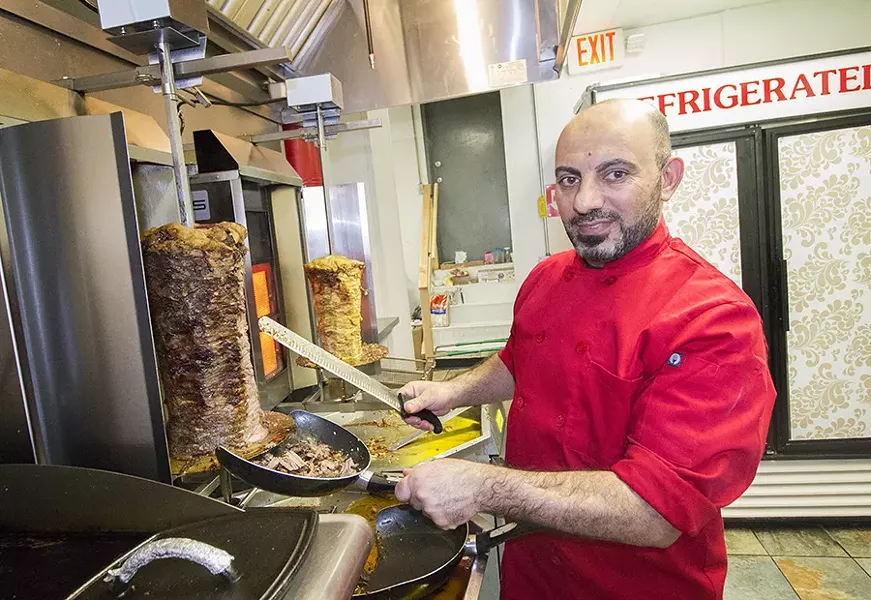 The restaurant's namesake shawarma is in full view of the dining area. - MABEL SUEN