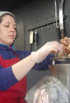 Chef Ari Ellis preparing the housemade sausage in Southern's kitchen.