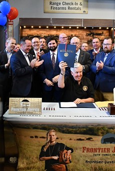 Gov. Mike Parson celebrates the signing of Missouri's Second Amendment Preservation Act" at a gun range.