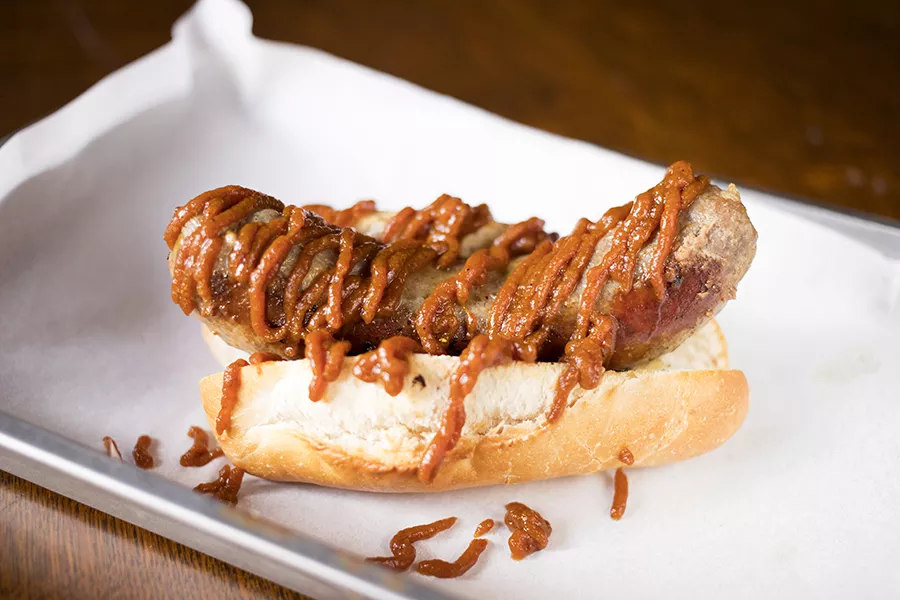 Ellis tops her currywurst with curry-flavored ketchup. - MABEL SUEN