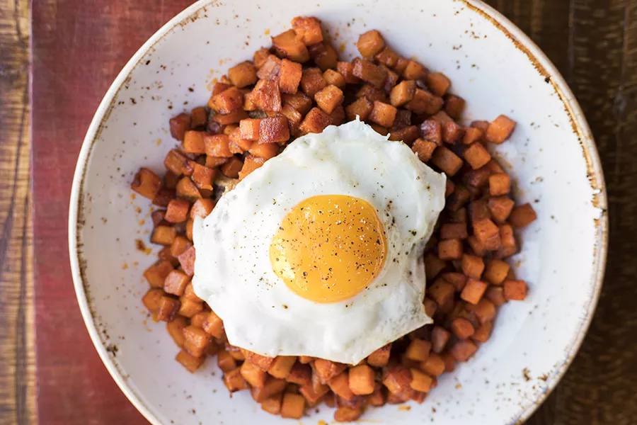 Hash with sweet potato, 100-layer apple, butterscotch, pork confit and fried egg. - MABEL SUEN