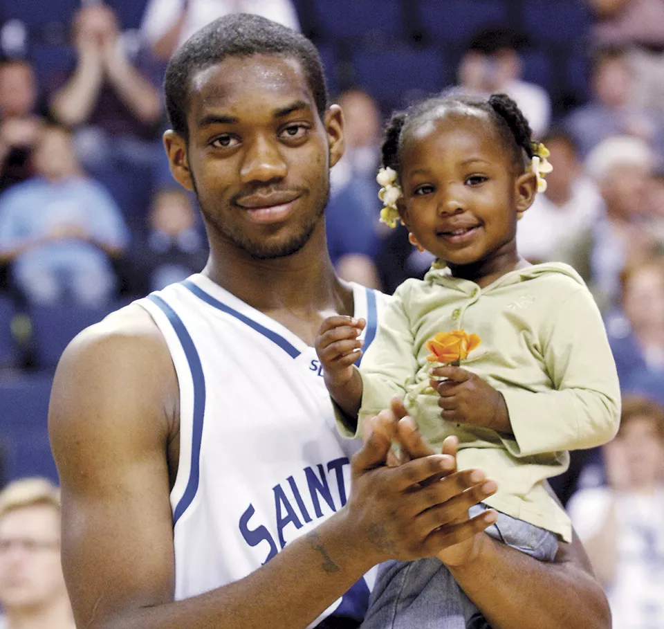 Liddell holds his daughter Taja, now ten. - BILL BARRETT