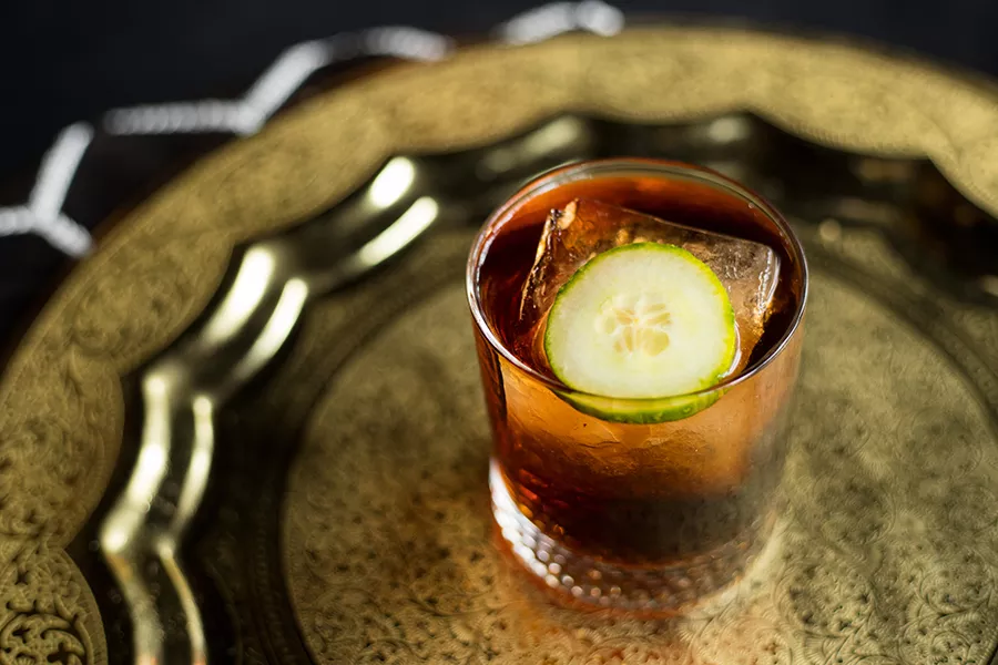 Cocktails include "the Amir," with dry gin, Montanaro Rouge Vermouth, crème de cassis, limoncello, Fernet-Vallet, black-lemon bitters and cucumber. - MABEL SUEN