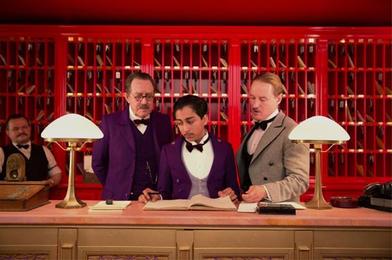 Still of Owen Wilson, Tom Wilkinson and Tony Revolori in The Grand Budapest Hotel.