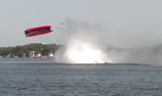A boat racing in the Lake of the Ozarks Shootout flips into the air and crashes. - VIA YOUTUBE