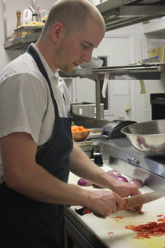 Executive sous chef Josh Poletti prepares the shift's family meal. | Nancy Stiles