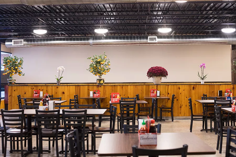 The dining room is vast, with nothing to divide the space. - MABEL SUEN