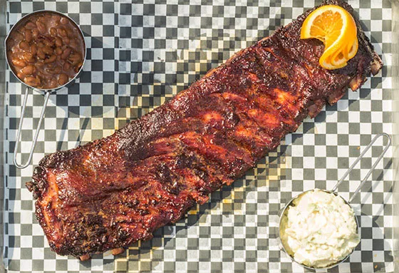 Ribs with baked beans and cole slaw. - MABEL SUEN