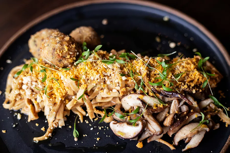 Mama Lee’s Noodles, which are a nod to the noodles Lee’s mother cooked to celebrate the Lunar New Year, are thick and slicked with peanut sauce. - MABEL SUEN