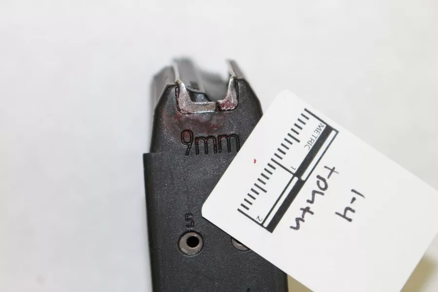 The Glock's clip with blood on it. - ST. LOUIS METROPOLITAN POLICE