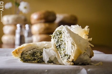 A spinach and cheese phyllo pocket from Balsam Bagels. - PHOTO BY MARK CHAMBERLIN