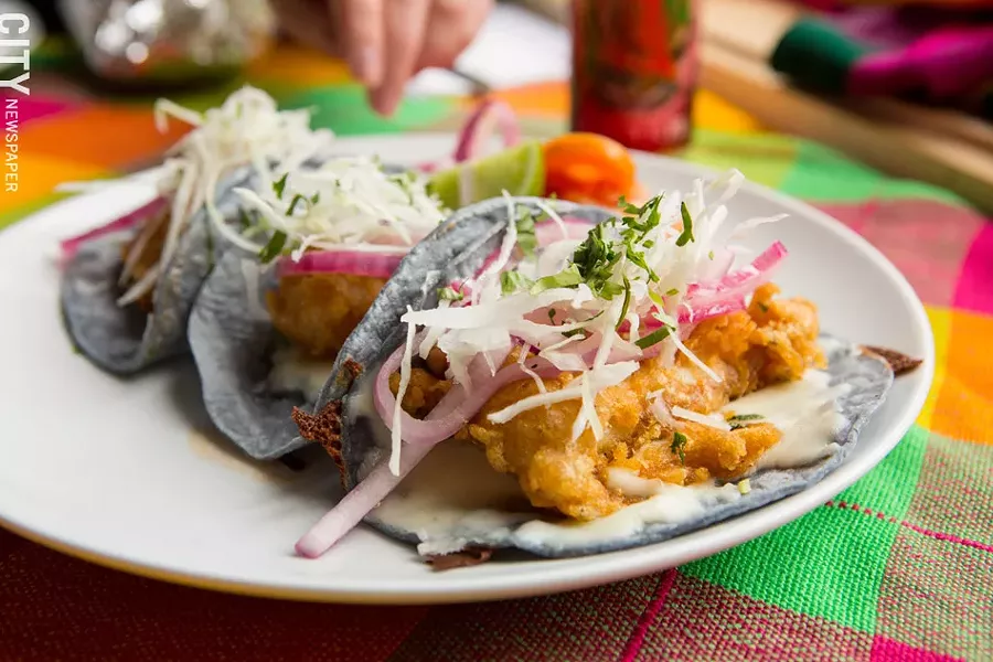 Beer-battered tilapia tacos from Rio Tomatlan. - PHOTO BY JOHN SCHLIA