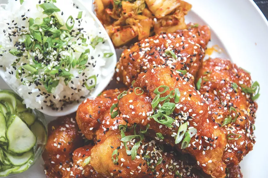 Butapub’s Korean Fried Chicken served with gochujang, kim chi, pickles, and rice. - PHOTO BY MARK CHAMBERLIN