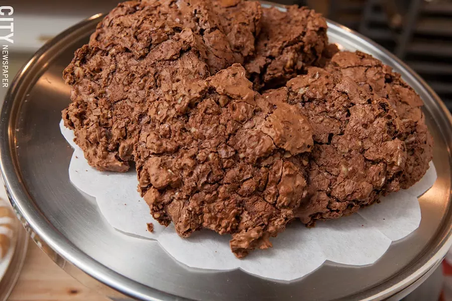 Flourless Chocolate Chewies are part of the regular baked good selection at Atlas Eats. - PHOTO BY JOHN SCHLIA