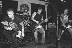 In addition to his prolific illustration work, Doug Mac (pictured, far right) is the bassist for local band Rock 'n' Roll Social Club. - PHOTO BY FRANK DE BLASE