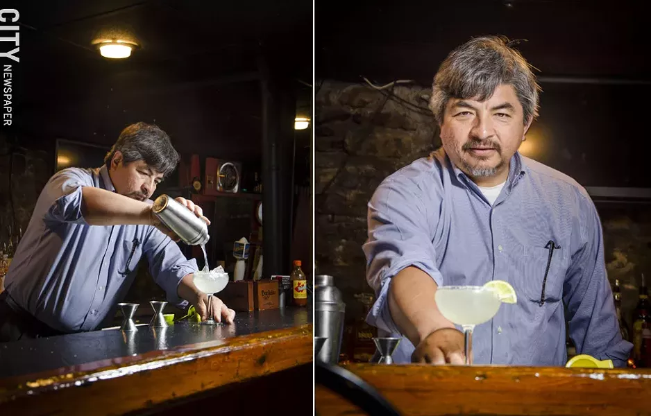Jose Abarca pours a margarita with fresh lime juice at Itacate in Penfield. Jose and his wife, both natives of Mexico, are making a point to use traditional family recipes for authentic Mexican meals. - PHOTO BY MARK CHAMBERLIN
