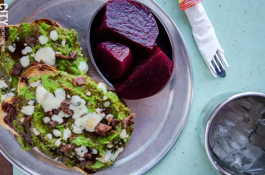 Mashed pea: roasted peas seasoned and mashed, served hot and open with melted gorgonzola, pomegranate balsamic drizzle and crumbly bacon on toasted sourdough, with pickled beets. - PHOTO BY MARK CHAMBERLIN