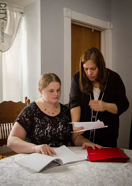Parent Sarah Johns (left) with Parents as Advocates instructor Susan Hall. - PHOTO BY MARK CHAMBERLIN