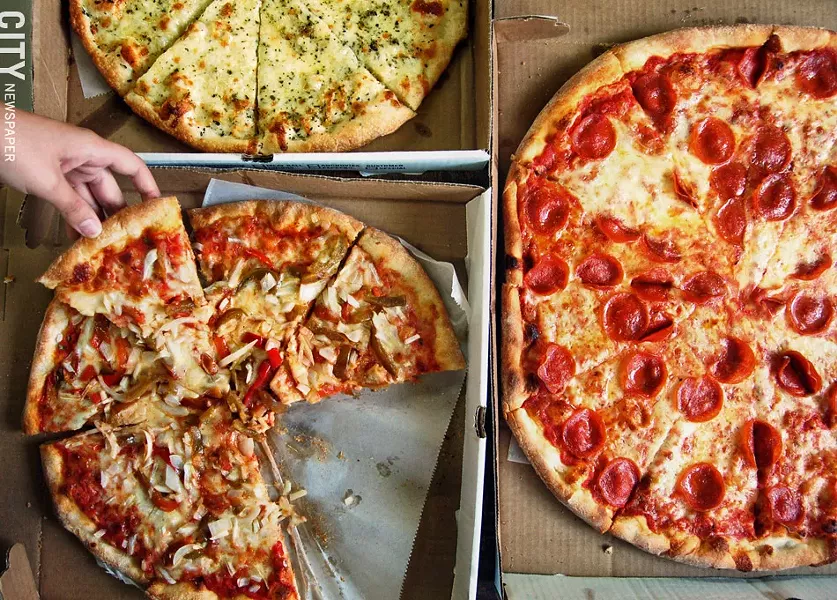 Pick up a slice from The Pizza Stop. - FILE PHOTO