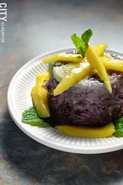 Purple rice dessert with sweet custard and mango. - PHOTO BY MATT DETURCK