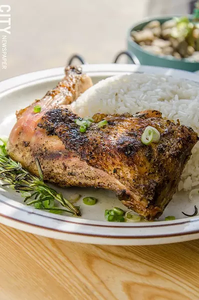 Roast chicken with rosemary, scallions, and rice from La Marifinga.