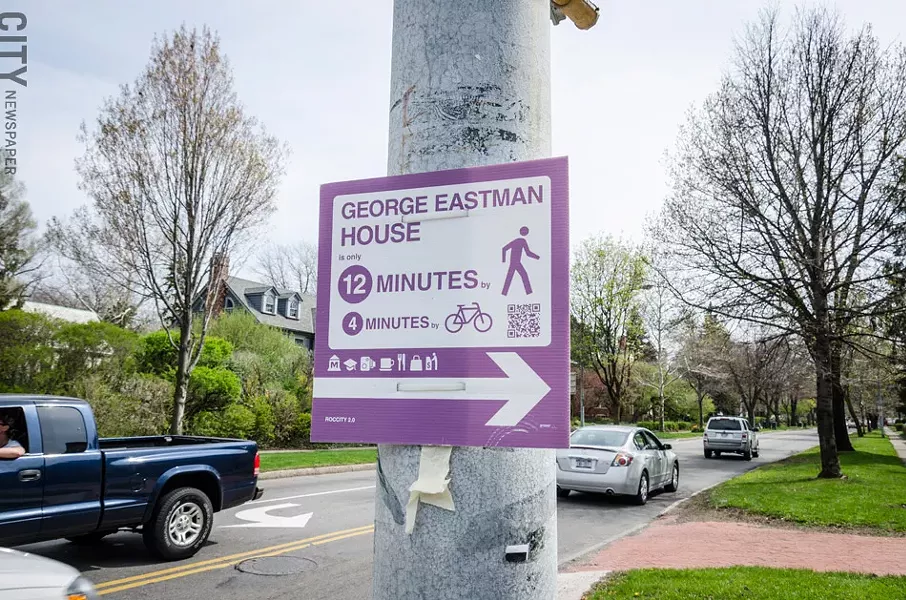 RocCity 2.0 made signs directing people to Rochester attractions. The signs are attached to signal poles around the city. - PHOTO BY MARK CHAMBERLIN