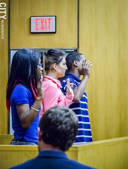 Teen jurors are sworn in before hearing a case. - PHOTO BY MARK CHAMBERLIN