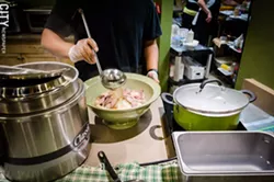 The SOUPer Bowl Challenge involves consuming seven pounds of pho in less than 45 minutes at The Soup Spoon in Victor. - PHOTO BY MARK CHAMBERLIN