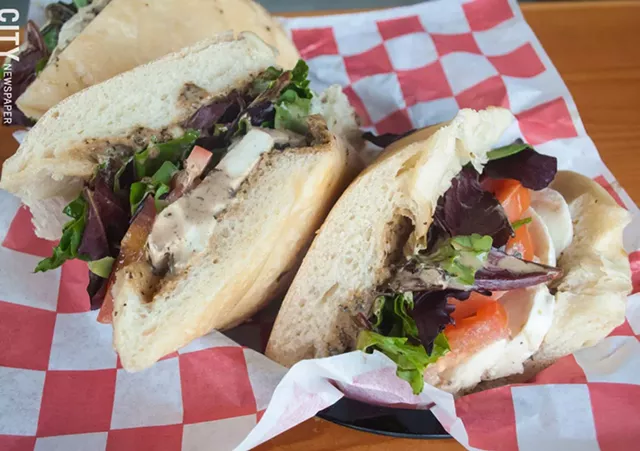 The Caprese sub at TinRoof Bar & Grill is a hearty sandwich, drizzled with balsamic vinegar and pesto. - PHOTO BY JACOB WALSH