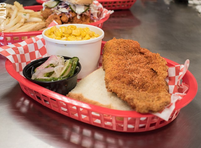 The (off-menu) fried catfish with cucumber tangy onion salad and corn sides. - PHOTO BY JACOB WALSH