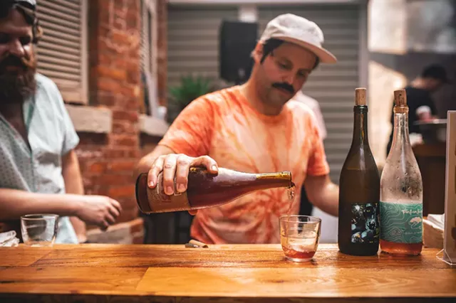 Brandon Opalich pours curated wine selections at the first Aldaskeller Wine Co. pop-up tasting event at Swan Dive. - PHOTO BY JASON CAMPBELL